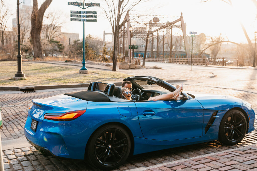 photo of couple in sports car in St. Anthony Main, Minneapolis. 