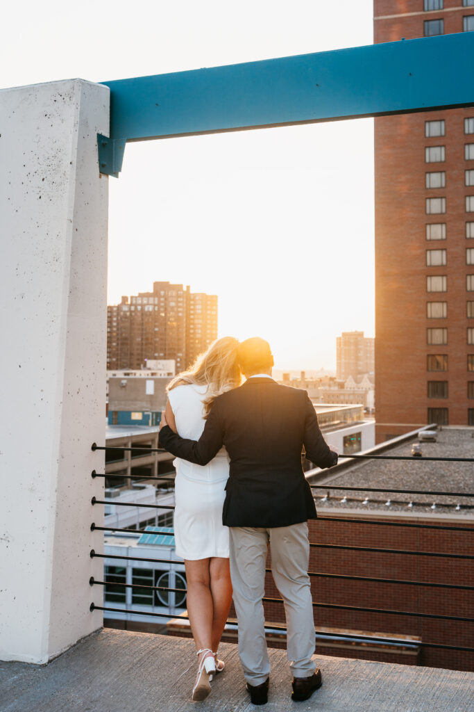 photo of couple standing on a parking ramp near St. Anthony Main, Minneapolis. 
