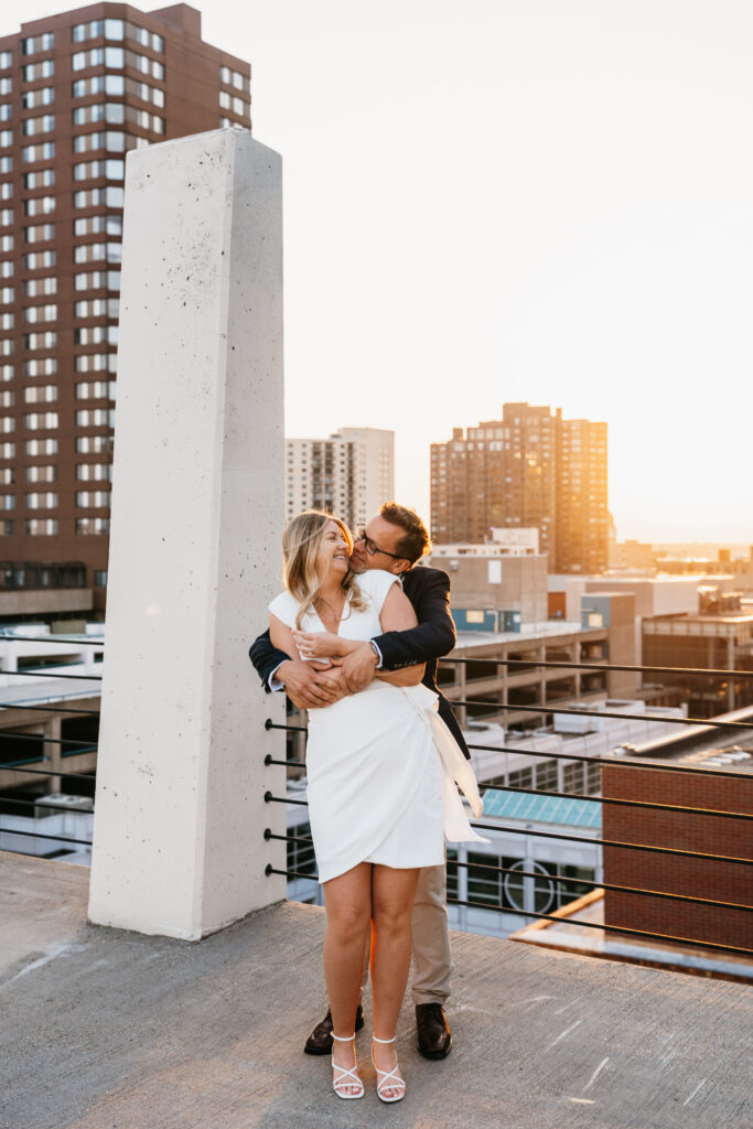 photo of couple standing on a parking ramp near St. Anthony Main, Minneapolis. 